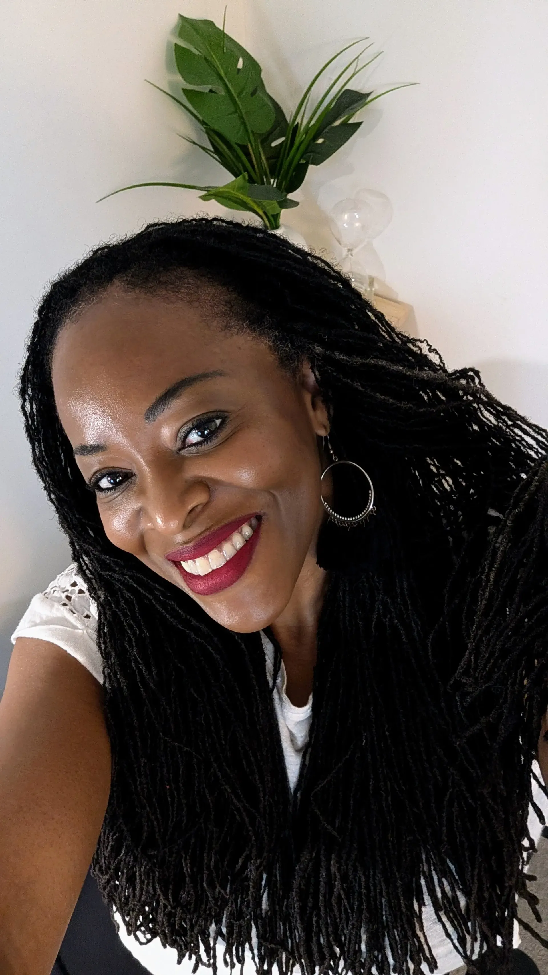 OlaBISI MacGregor smiling in a white top